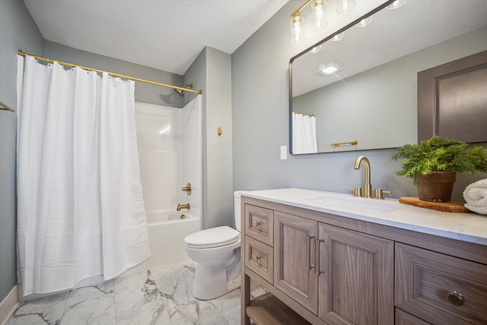 Bathroom remodel with clean tile lines and modern fixtures
