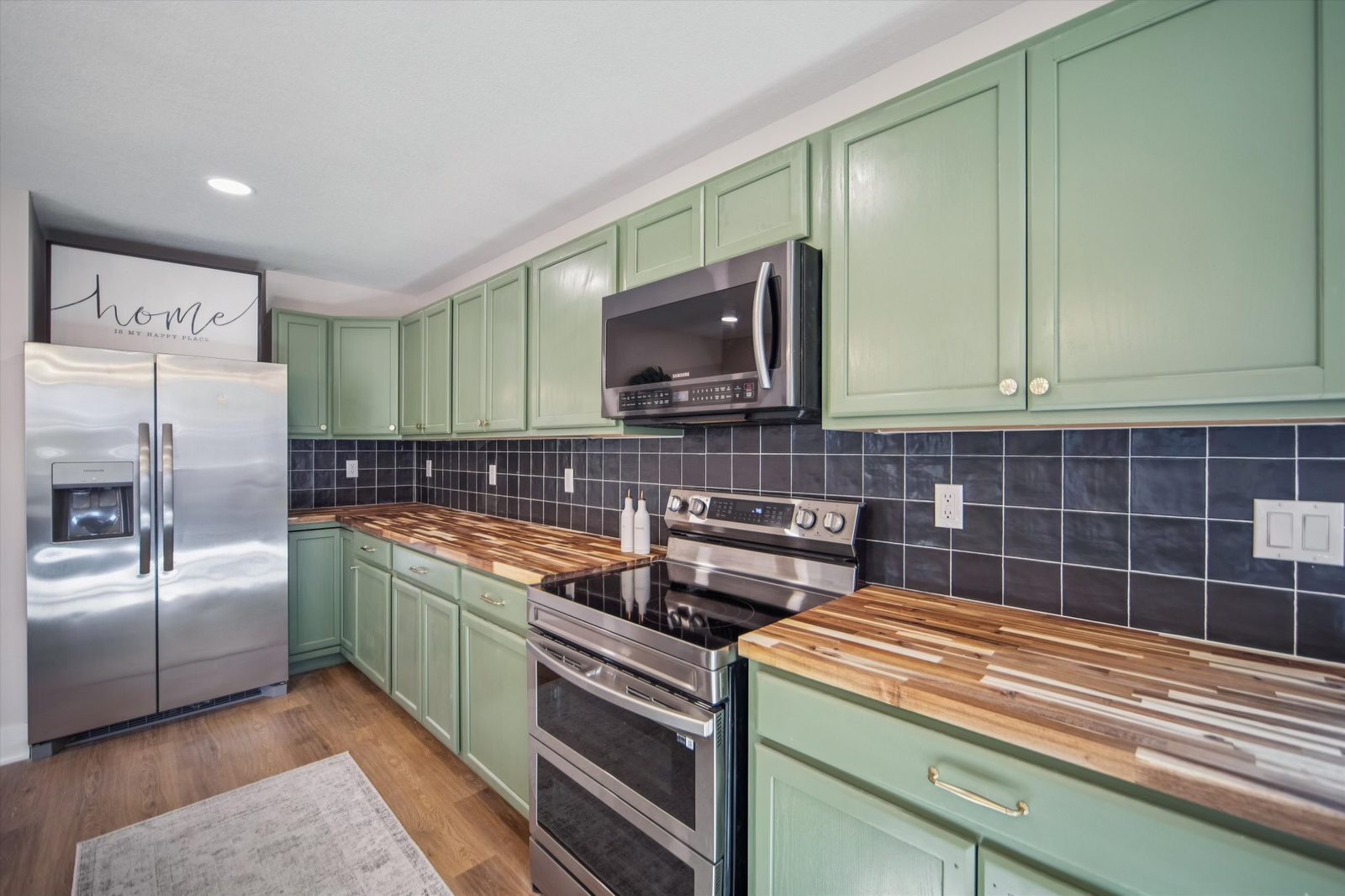 Kitchen remodel detail with island and pendant lighting