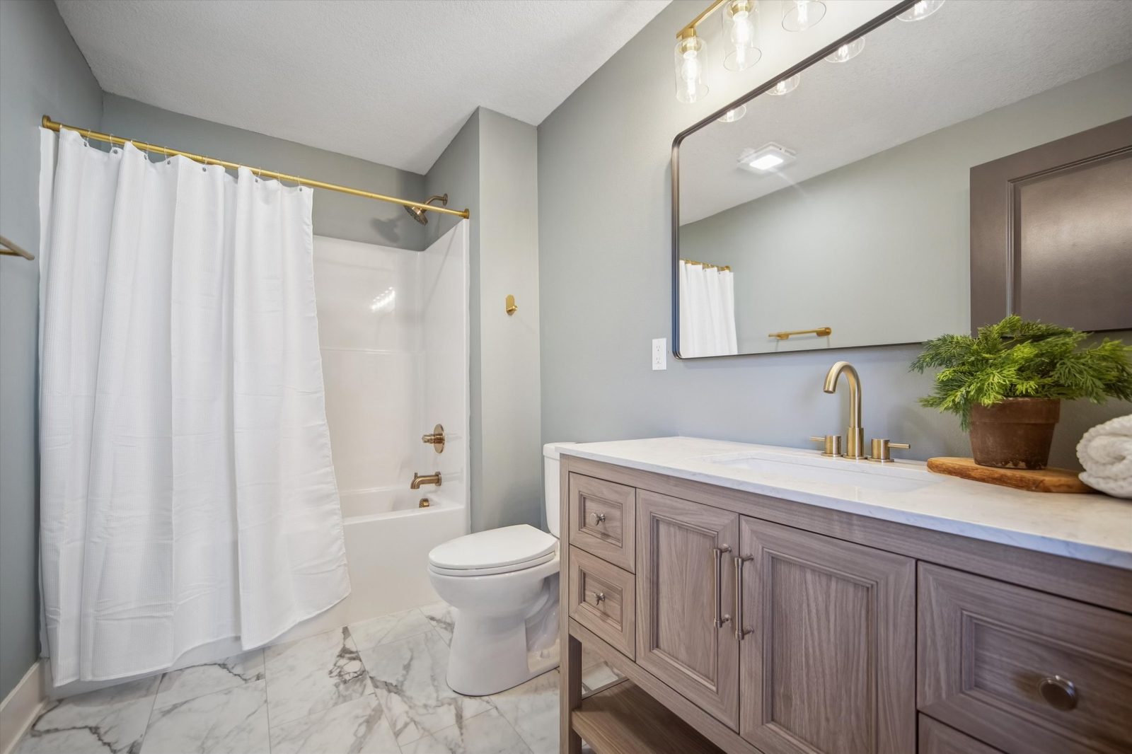 Bathroom remodel with modern tile and vanity